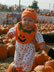 Standing on a pumpkin.