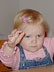 Raising the roof from her school desk.